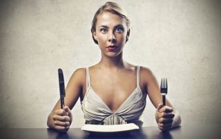 hungry-woman-with-empty-plate